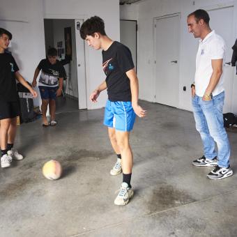 Illia and Alosha play soccer with Iker, one of their escape routes.