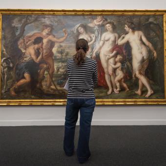 A visitor admires Rubens' painting "The Judgment of Paris" at CaixaForum Barcelona.
