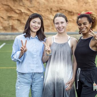 Shagufa, Viktoriia, and Ruby, players on the refugee women's team of the Ramassà Sports Association.