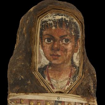Mummy of a child (detail). Hawara, Egypt Roman period, around AD 40–55. Human tissue, plaster, linen, resin and gold. © Trustees of the British Museum.
