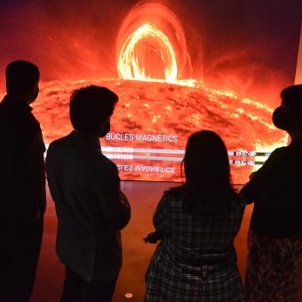 Visitors in the final immersive experience of CosmoCaixa.