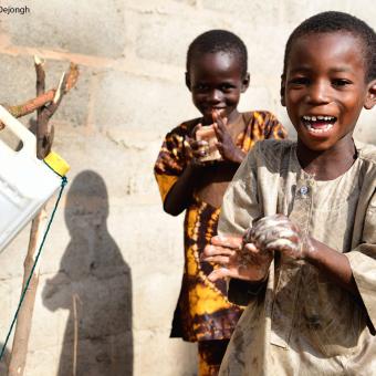 Children washing their hands in Burkina Faso. © UNICEF_UN0487704_Dejongh.