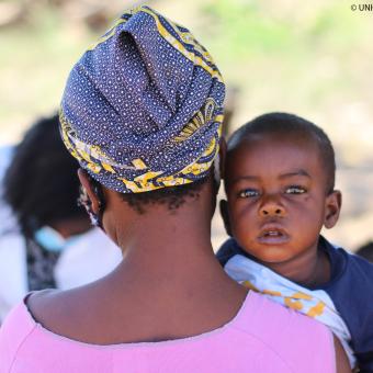 A woman and a baby during a vaccination campaign in Mozambique. © UNICEF_UN0535733_Lemos.