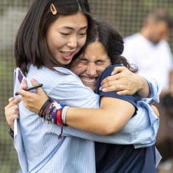 Shagufa (player) and Maria (coach) hug each other during the final training session and farewell of the season.
