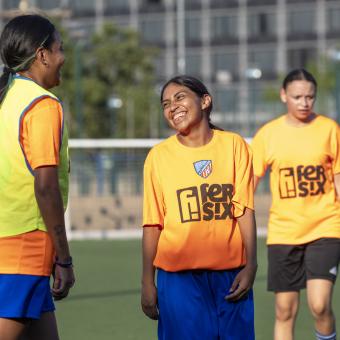 Relaxed moments during training for the refugee women's team from the Ramassà Sports Association.