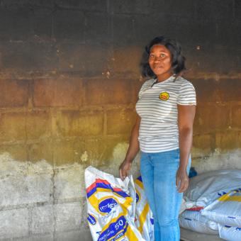 Assucenia José working on her chicken farm.