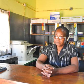 Crisália Nhambi in her stationery shop.