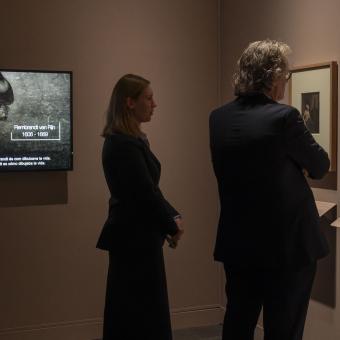 Two people admiring some of the works on display at the "Rembrandt: A World in Prints" exhibition at CaixaForum València.