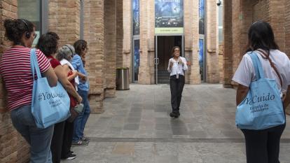 An educator from CaixaForum Barcelona introducing the exhibition to the group.