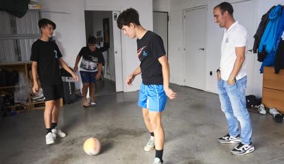 Illia and Alosha play soccer with Iker, one of their escape routes.