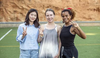 Shagufa, Viktoriia, and Ruby, players on the refugee women's team of the Ramassà Sports Association.