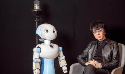 Roboticist and engineer Hiroshi Ishiguro with Robovie, one of his creations.