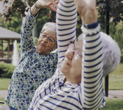 Two women taking gymnastics classes.