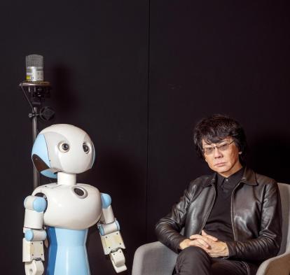 Roboticist and engineer Hiroshi Ishiguro with Robovie, one of his creations.