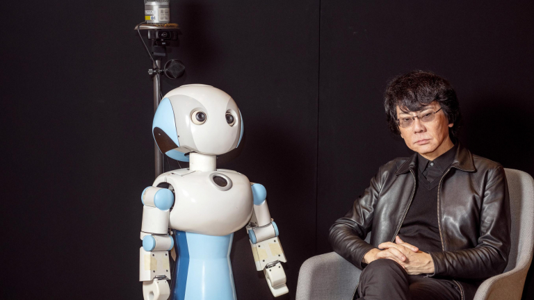 Roboticist and engineer Hiroshi Ishiguro with Robovie, one of his creations.